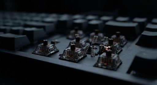 Macro shot of mechanical switches beneath the keycaps
